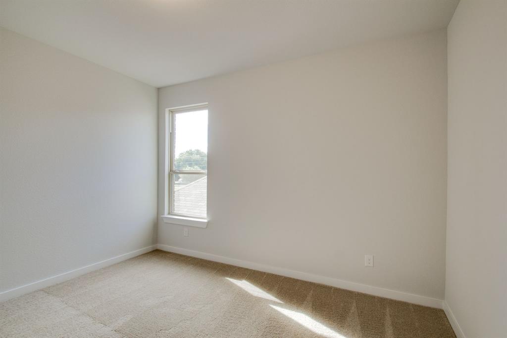 7612 Spring Drive Watauga, TX 76148 - Photo 27 of 40 an empty room with windows