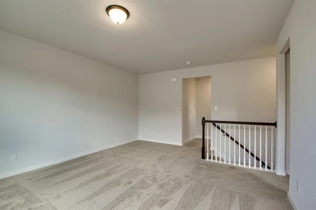 a view of kitchen with livingroom and wooden floor