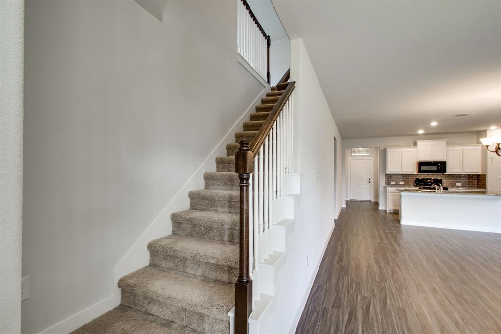 7612 Spring Drive Watauga, TX 76148 - Photo 30 of 40 a view of kitchen with livingroom and wooden floor