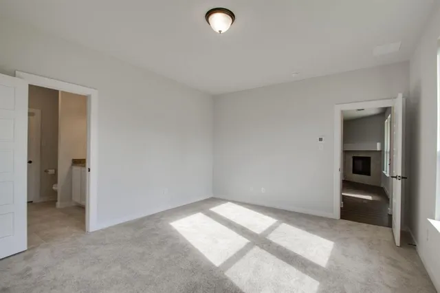 a view of backyard with wooden fence