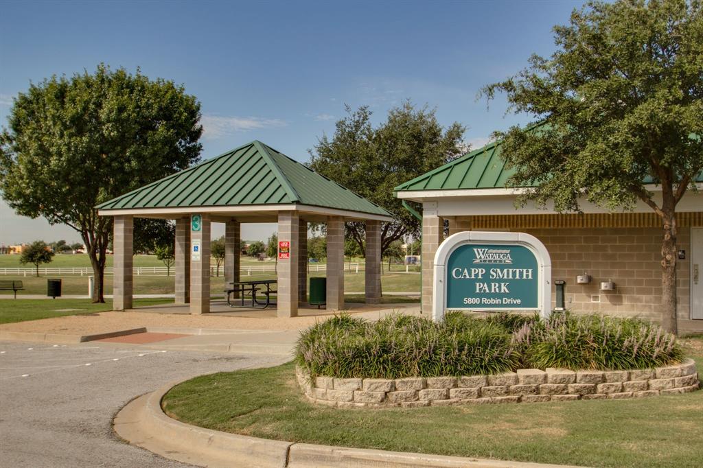 7612 Spring Drive Watauga, TX 76148 - Photo 39 of 40 a front view of a house with garden