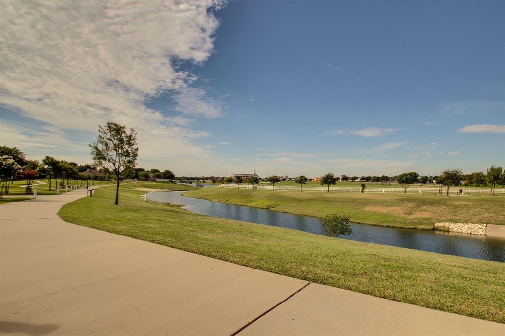 7612 Spring Drive Watauga, TX 76148 - Photo 40 of 40 a view of a lake with a big yard and palm trees