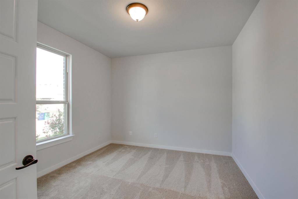 7612 Spring Drive Watauga, TX 76148 - Photo 8 of 40 an empty room with a window