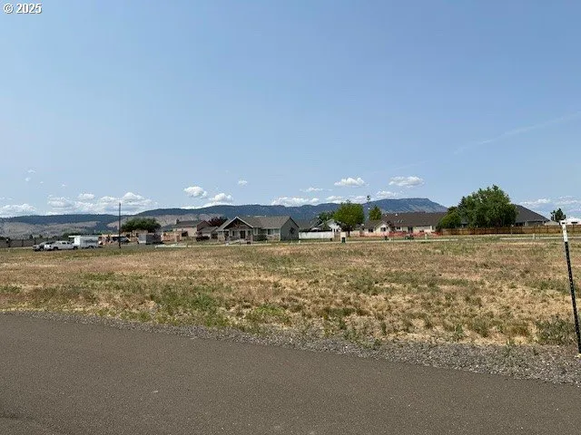 a view of a street with an ocean view