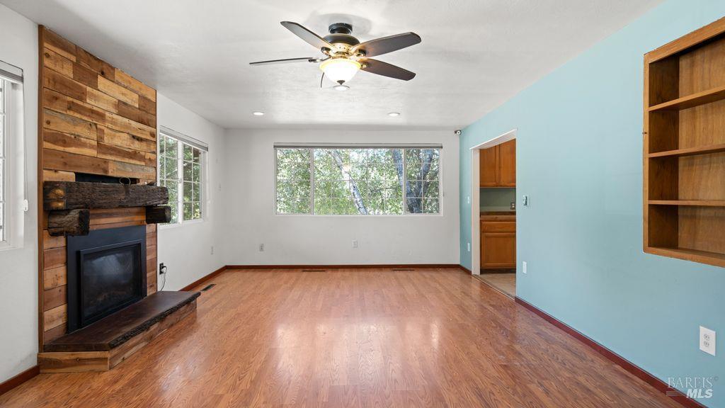 40 El Rancho Drive Cloverdale, CA 95425 - Photo 12 of 44 wooden floor in an empty room with a window