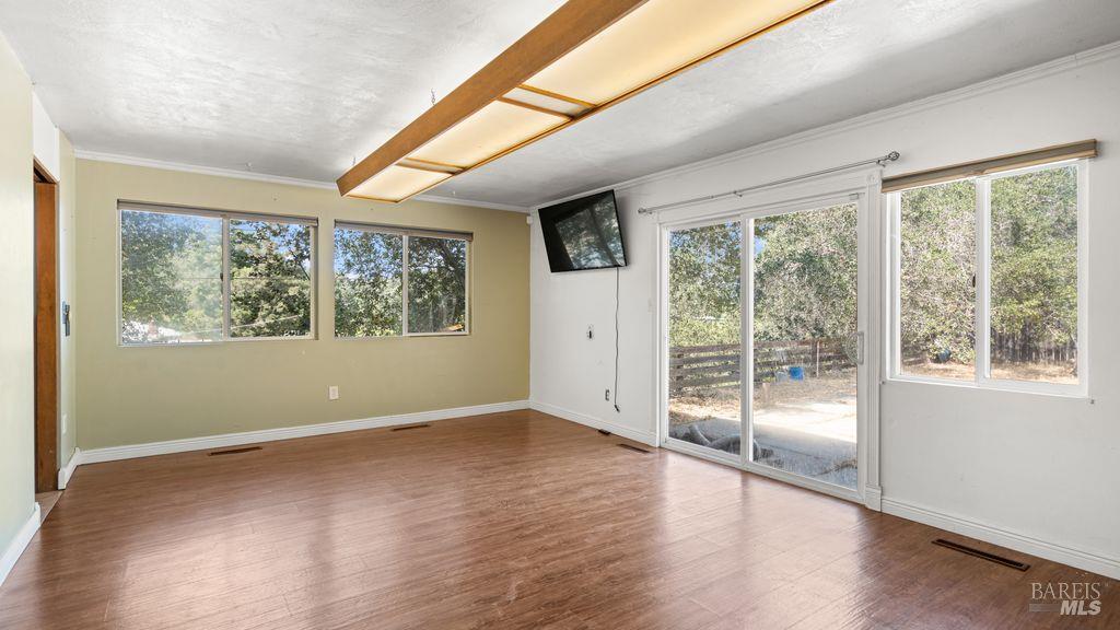 40 El Rancho Drive Cloverdale, CA 95425 - Photo 18 of 44 a view of empty room with wooden floor and fan