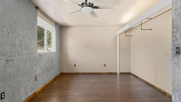 a view of room with window and hardwood floor