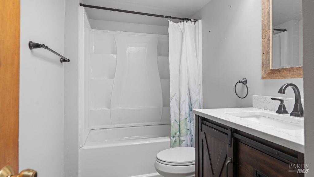 40 El Rancho Drive Cloverdale, CA 95425 - Photo 23 of 44 a bathroom with a sink a toilet and shower