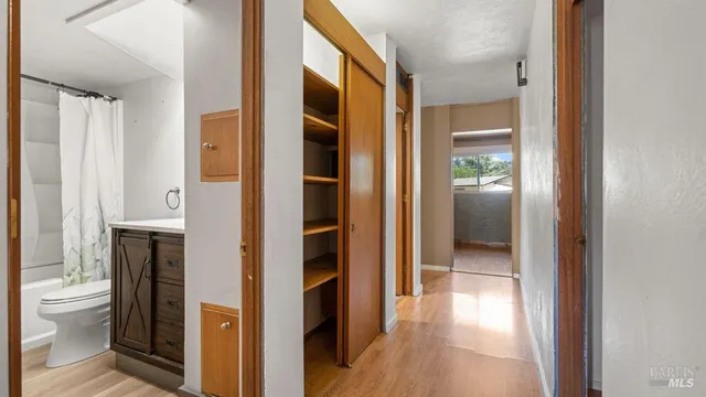 a bathroom with a glass door shower
