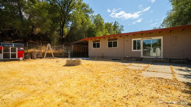 a house with trees in front of it