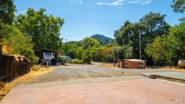 a house with trees in the background