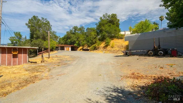 a view of a house with a snow in the yard