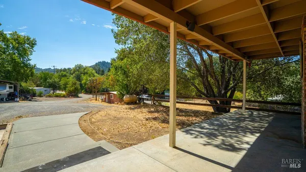 a view of a backyard of the house