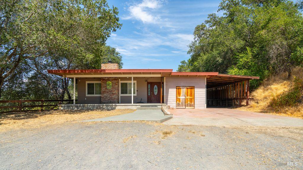 40 El Rancho Drive Cloverdale, CA 95425 - Photo 7 of 44 a front view of a house with a yard and garage