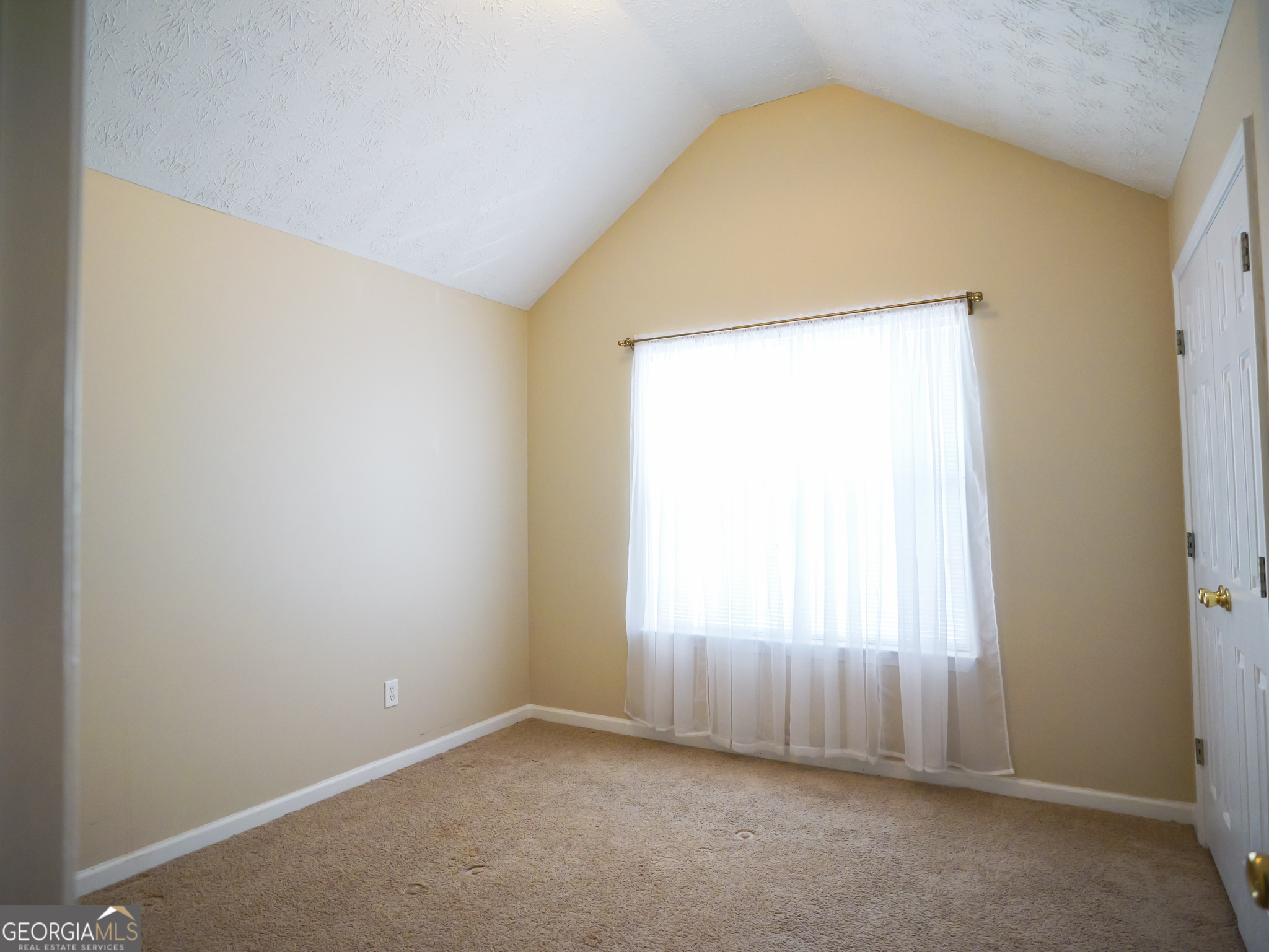 11036 Pebble Ridge Drive Hampton, GA 30228 - Photo 23 of 35 an empty room with a window