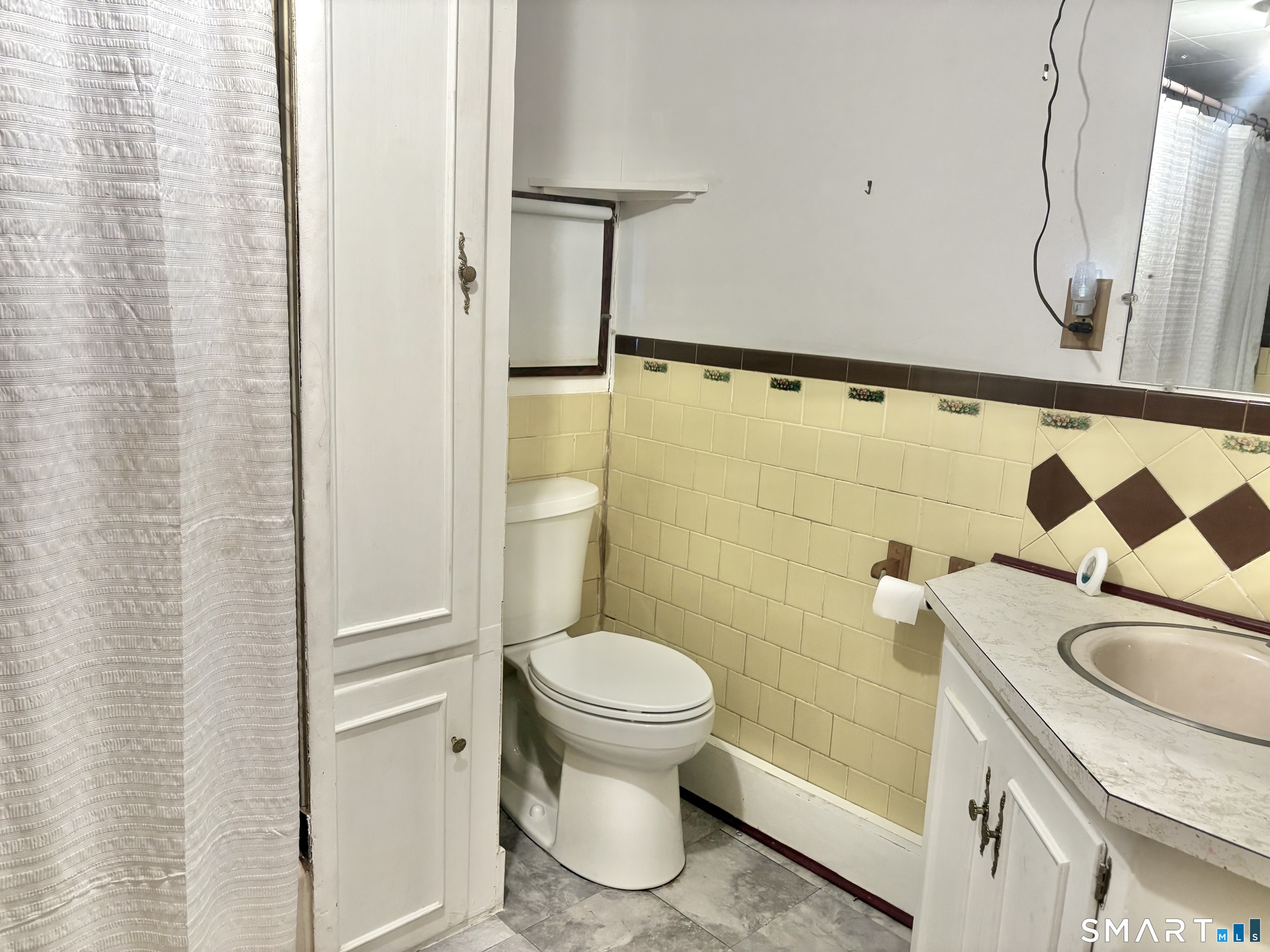 21 Friendship Street Norwich, CT 06360 - Photo 12 of 17 a bathroom with a sink a toilet and shower curtain