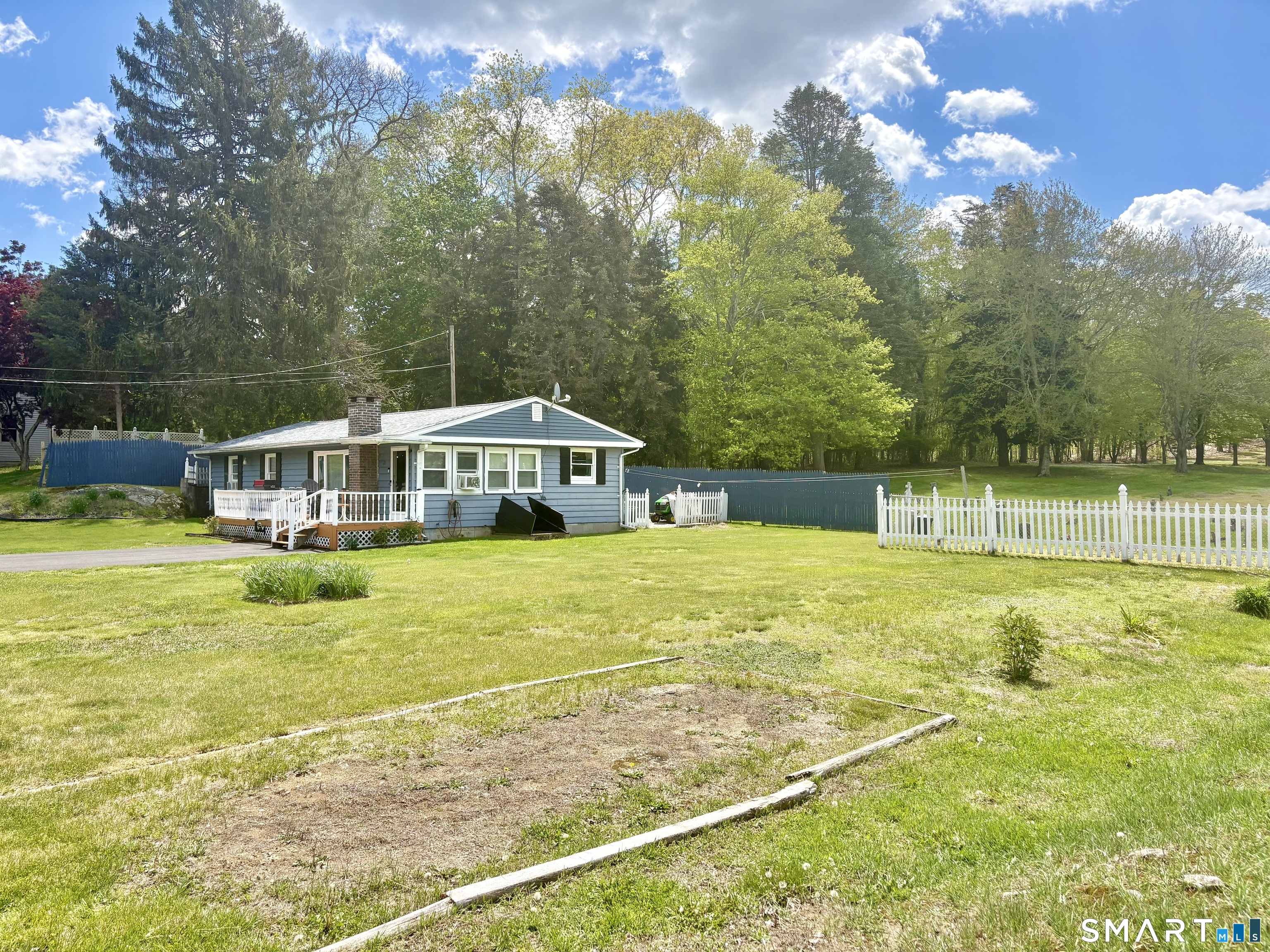21 Friendship Street Norwich, CT 06360 - Photo 3 of 17 a swimming pool with trees in the background
