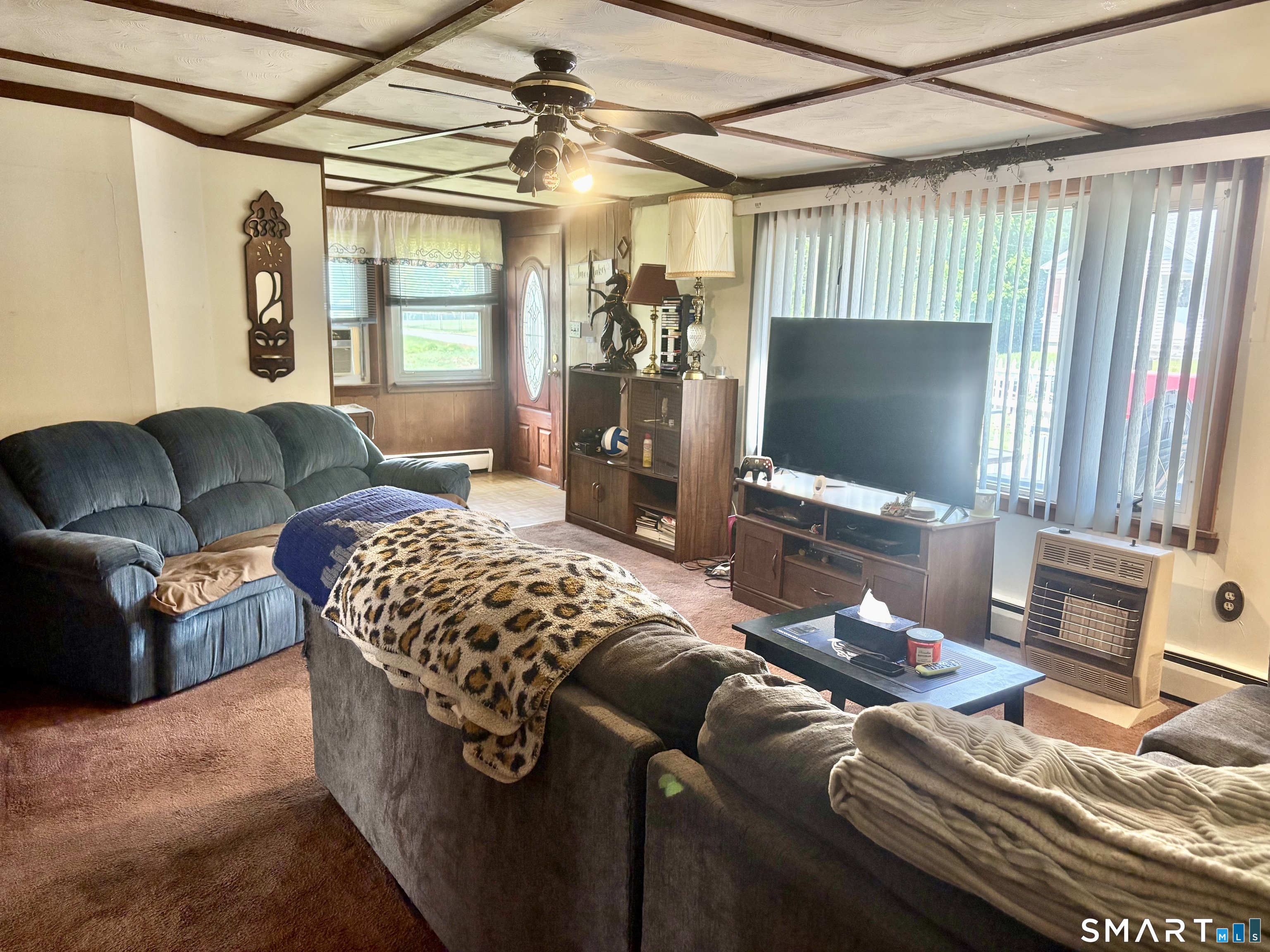 21 Friendship Street Norwich, CT 06360 - Photo 5 of 17 a living room with furniture and a flat screen tv
