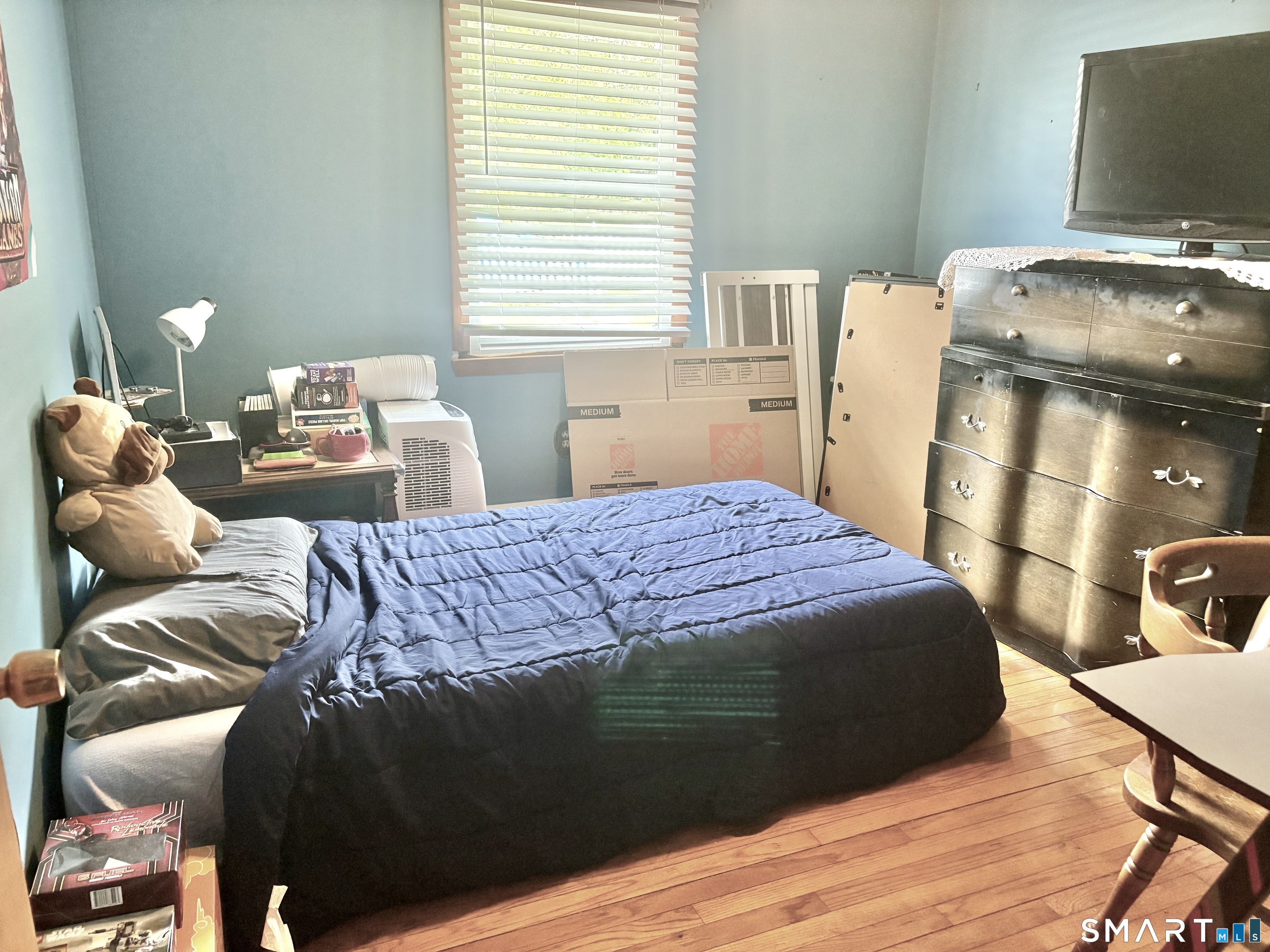 21 Friendship Street Norwich, CT 06360 - Photo 10 of 17 a bedroom with a bed and a tv
