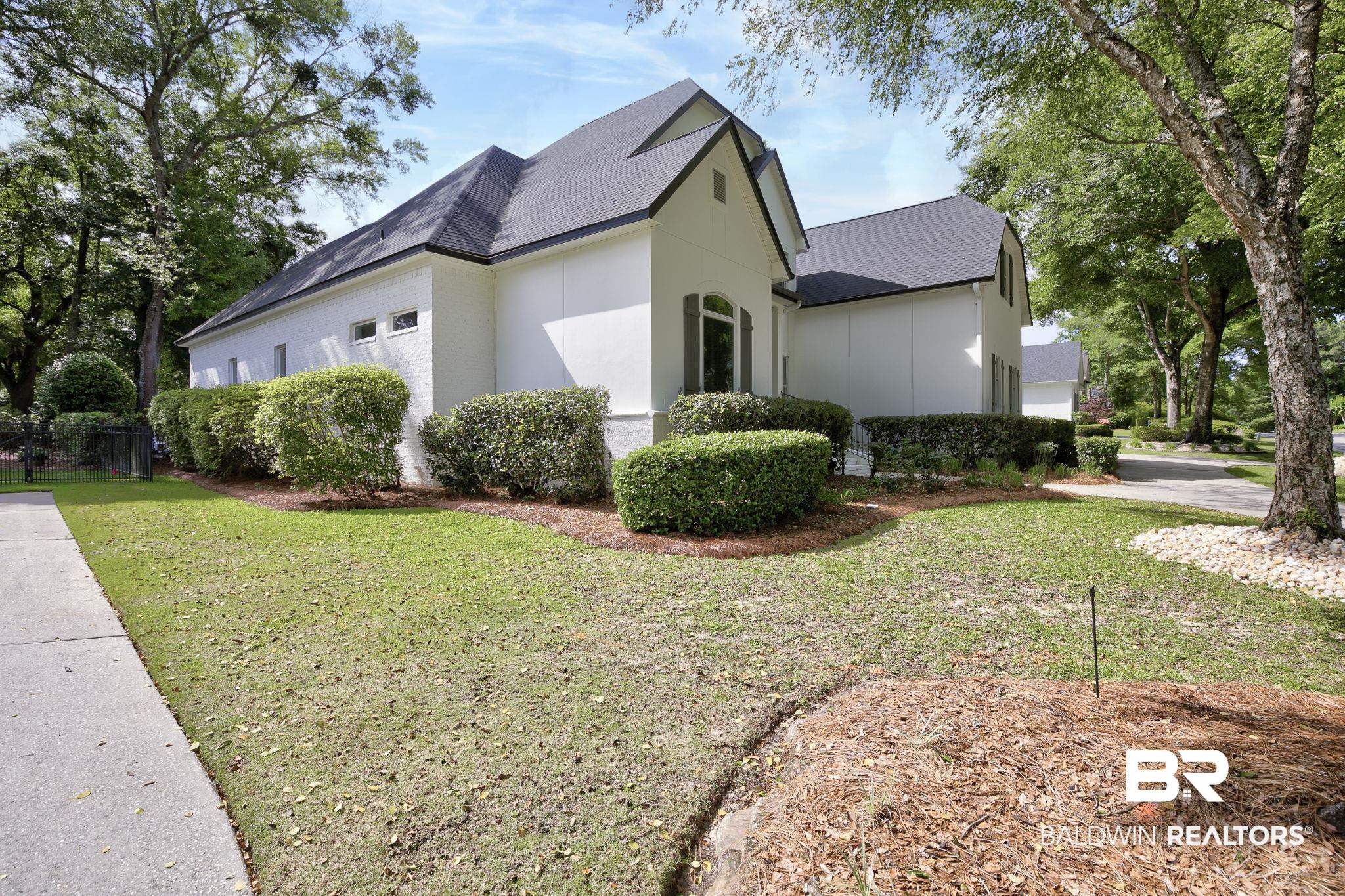 105 High Pines Ridge Fairhope, AL 36532 - Photo 84 of 97 View of home's exterior with roof with shingles and a lawn