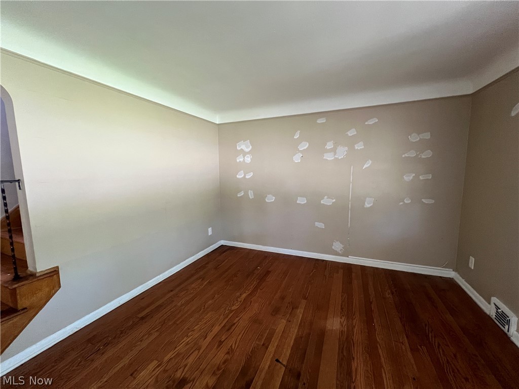 20731 Donnybrook Road Maple Heights, OH 44137 - Photo 5 of 17 Spare room with dark wood-type flooring