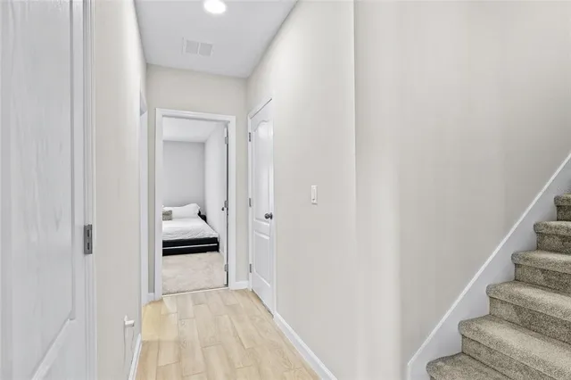 a view of a bedroom from the hallway