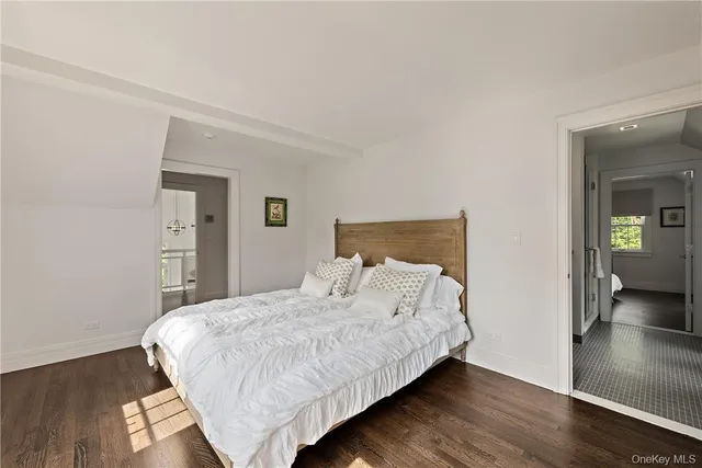 a bathroom with a sink tub vanity and toilet