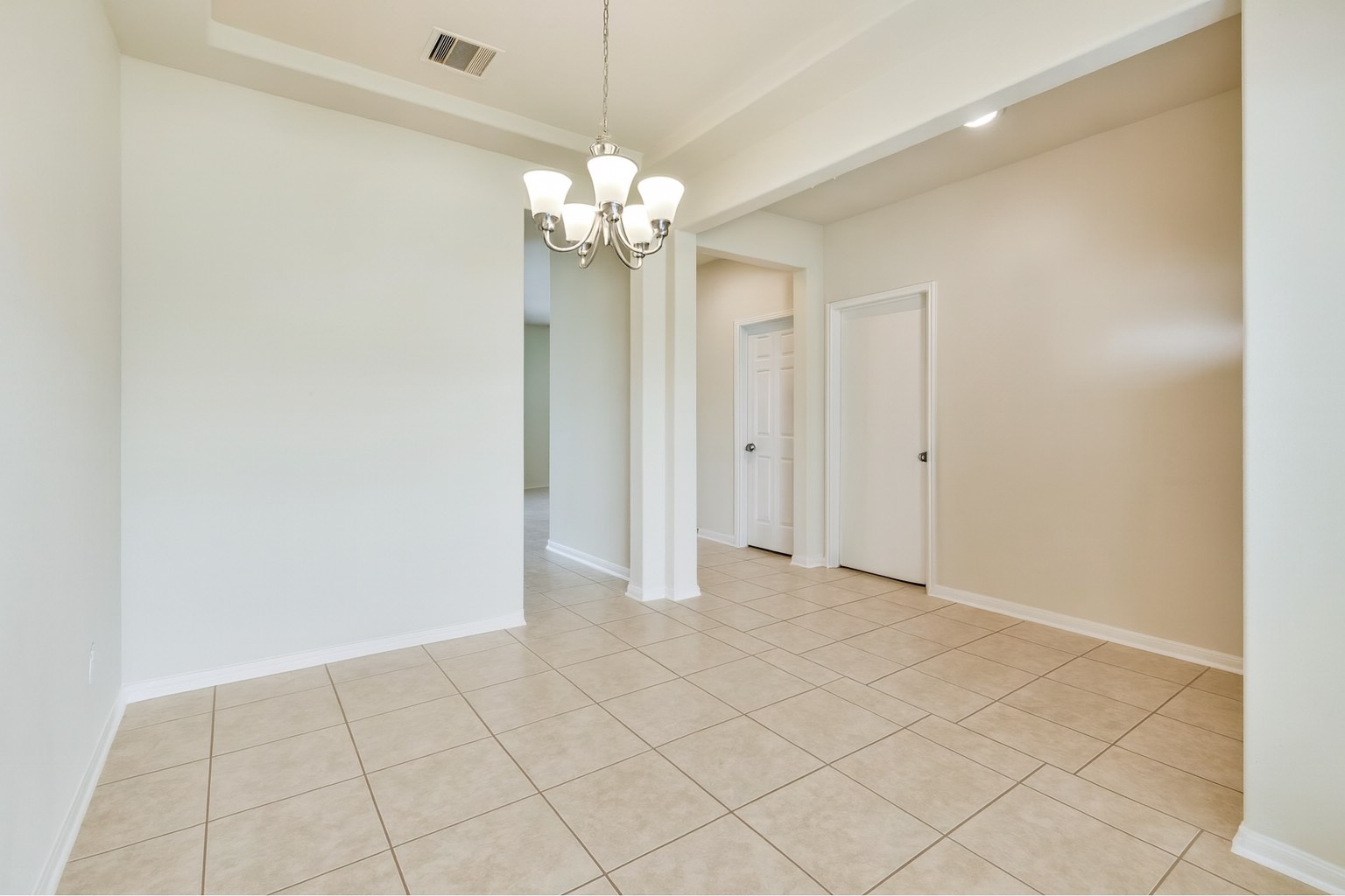 10930 Chestnut Path Way Tomball, TX 77375 - Photo 4 of 18 an empty room with chandelier fan