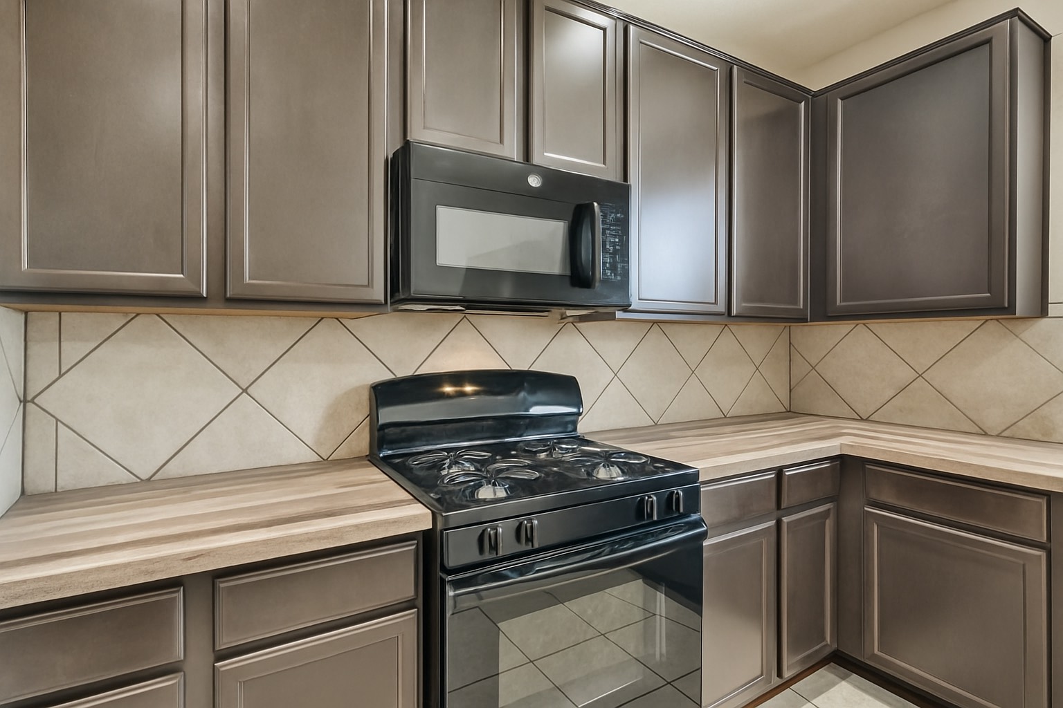 10930 Chestnut Path Way Tomball, TX 77375 - Photo 7 of 18 a kitchen with granite countertop cabinets and a stove top oven