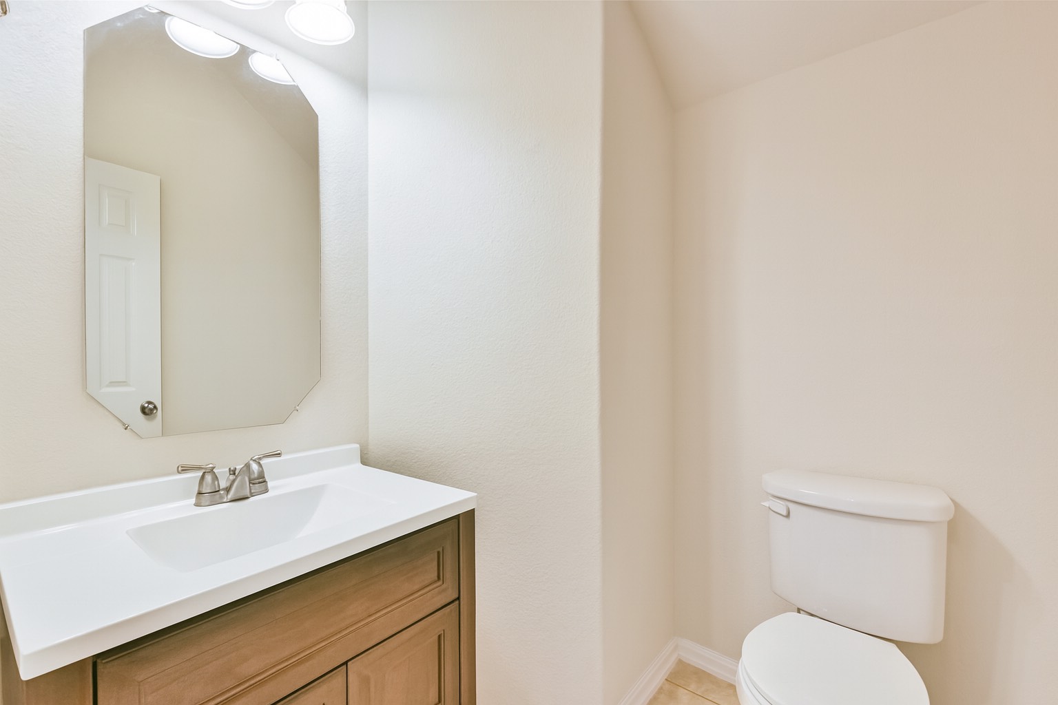 10930 Chestnut Path Way Tomball, TX 77375 - Photo 9 of 18 a bathroom with a sink vanity mirror and toilet