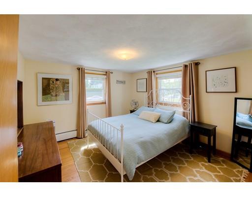 56 Edgewood Street Three Rivers, MA 01080 - Photo 8 of 30 a bedroom with a bed and wooden floor