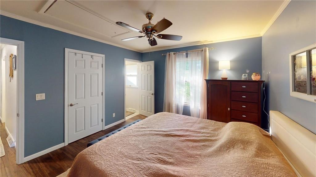 526 Unionville Road Butler, PA 16001 - Photo 10 of 18 a bedroom with a bed and a chandelier