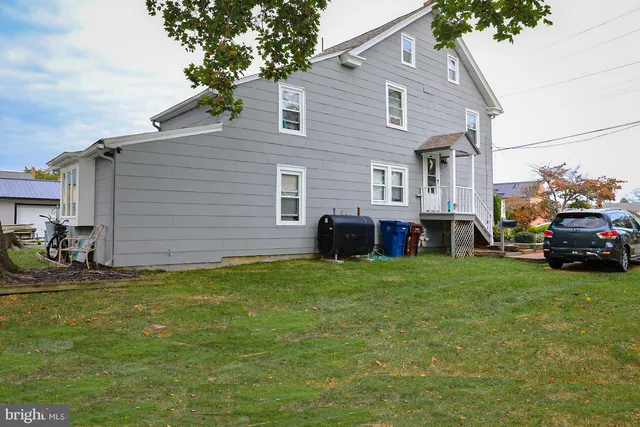 a living room with furniture and a clock