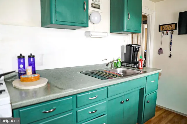 a bathroom with a sink vanity and mirror