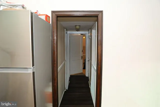 a room with pool table windows and wooden floor