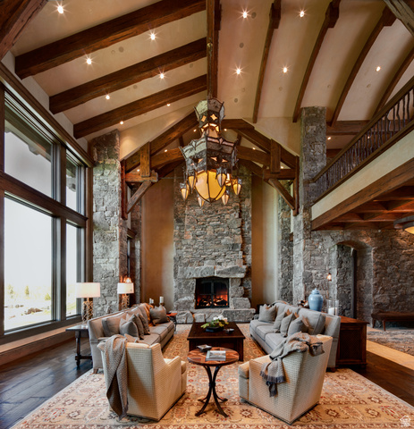 2322 North Westward Ho Road Heber City, UT 84036 - Photo 8 of 54 Living area with dark wood-style flooring, a stone fireplace, lofted ceiling, and recessed lighting