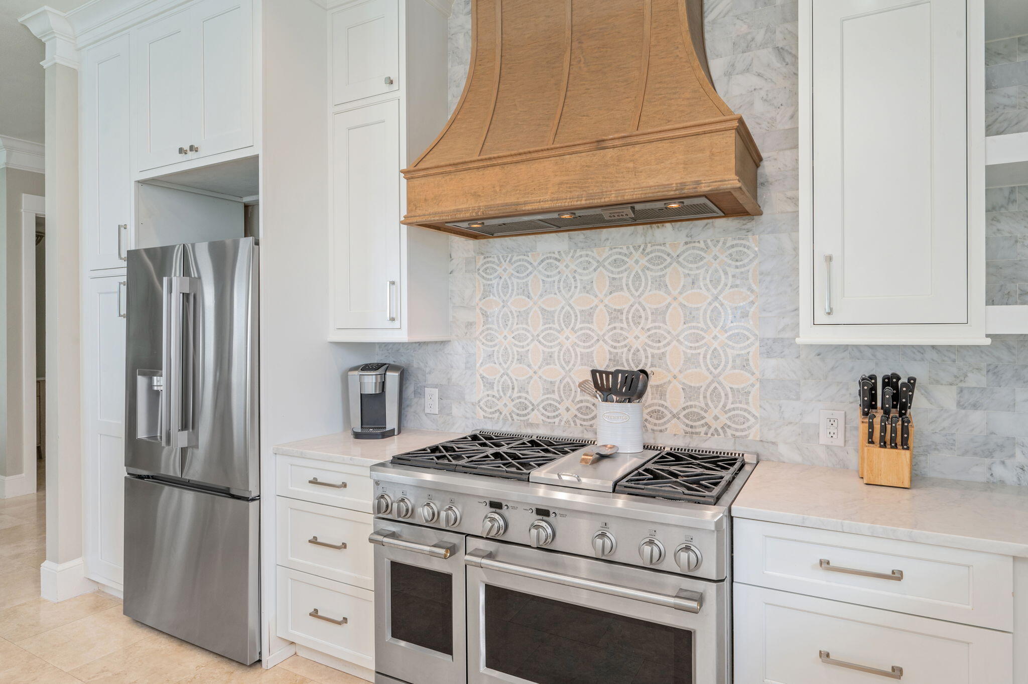 4525 West County Highway 30A Santa Rosa Beach, FL 32459 - Photo 31 of 118 a kitchen with stainless steel appliances granite countertop a stove a refrigerator and cabinets