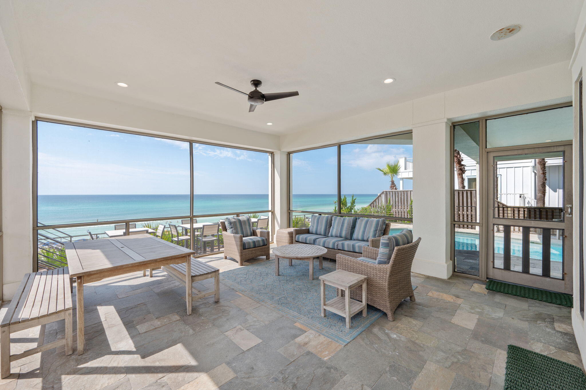 4525 West County Highway 30A Santa Rosa Beach, FL 32459 - Photo 38 of 118 a living room with patio furniture and a floor to ceiling window