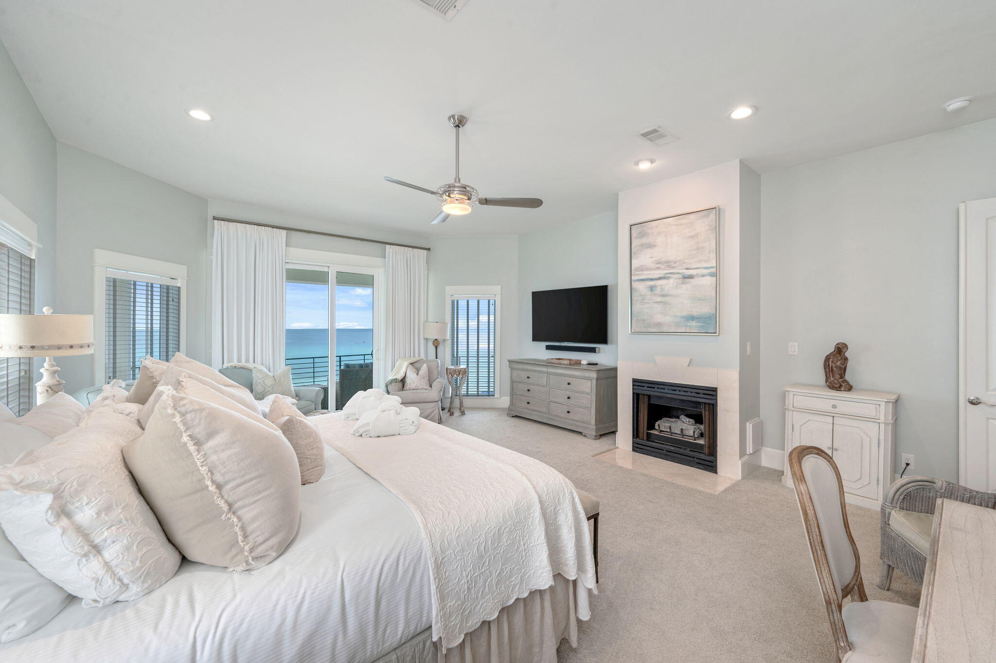 4525 West County Highway 30A Santa Rosa Beach, FL 32459 - Photo 65 of 118 a spacious bedroom with a bed and a flat screen tv