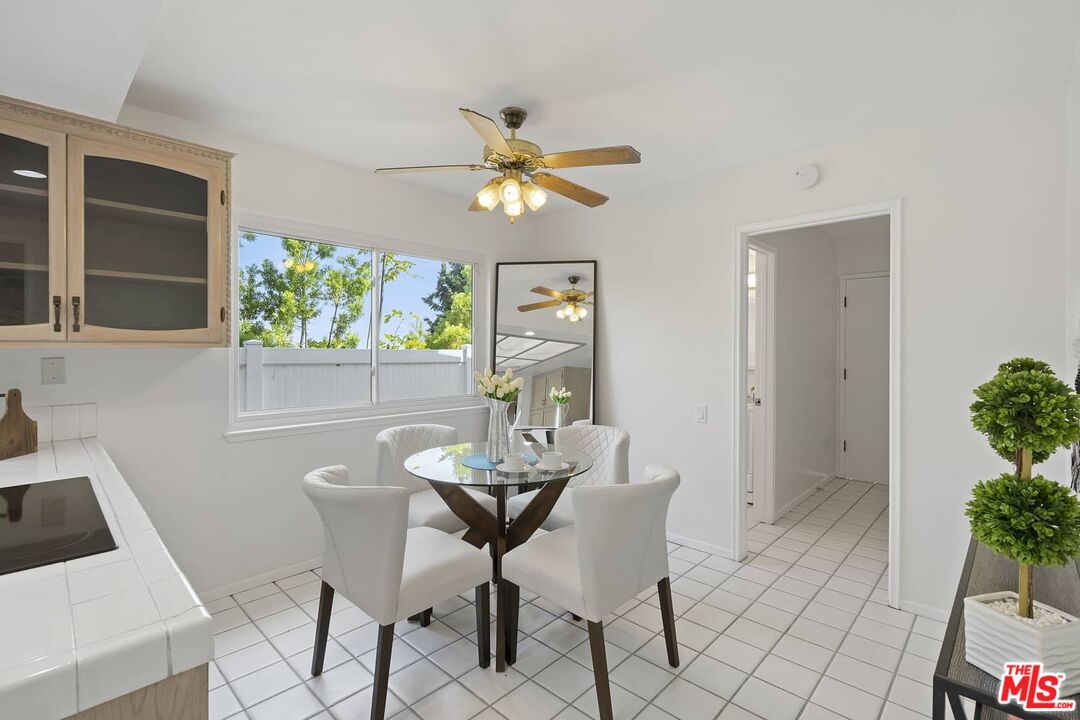 26741 Nokomis Road Rancho Palos Verdes, CA 90275 - Photo 11 of 28 a view of a dining room with furniture and a potted plant