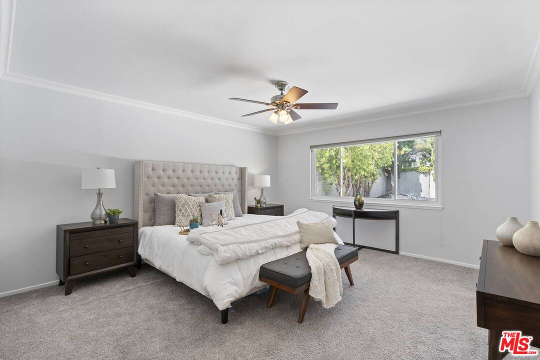 26741 Nokomis Road Rancho Palos Verdes, CA 90275 - Photo 19 of 28 a bedroom with a bed and a table in it with window