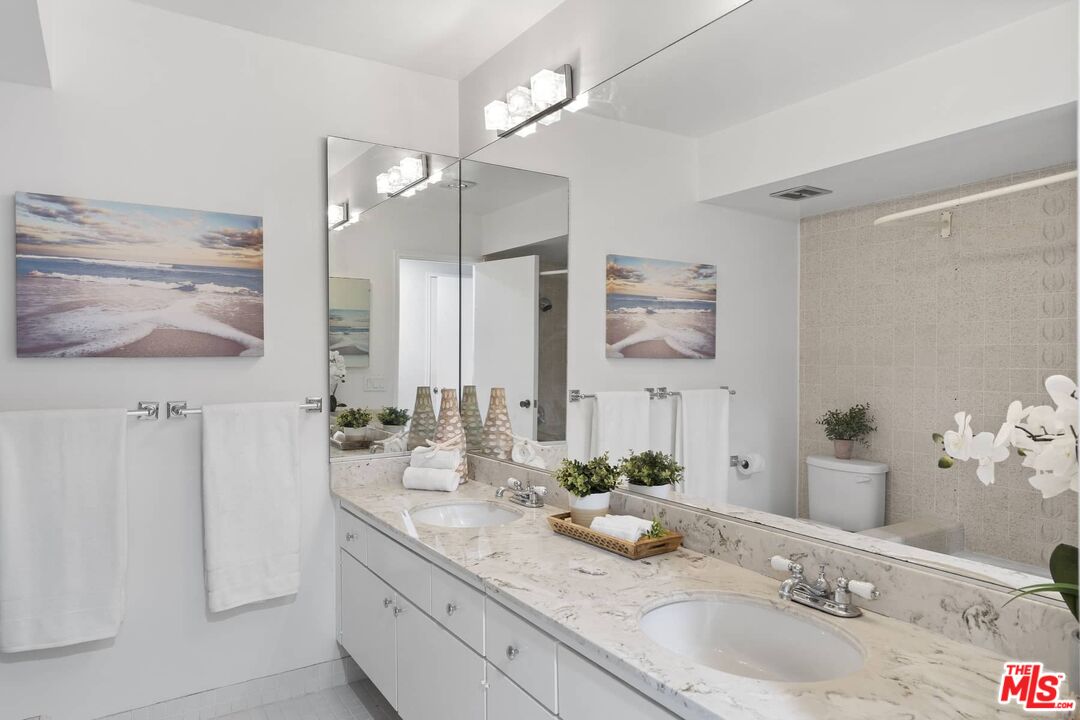 26741 Nokomis Road Rancho Palos Verdes, CA 90275 - Photo 20 of 28 a bathroom with a granite countertop sink and a mirror