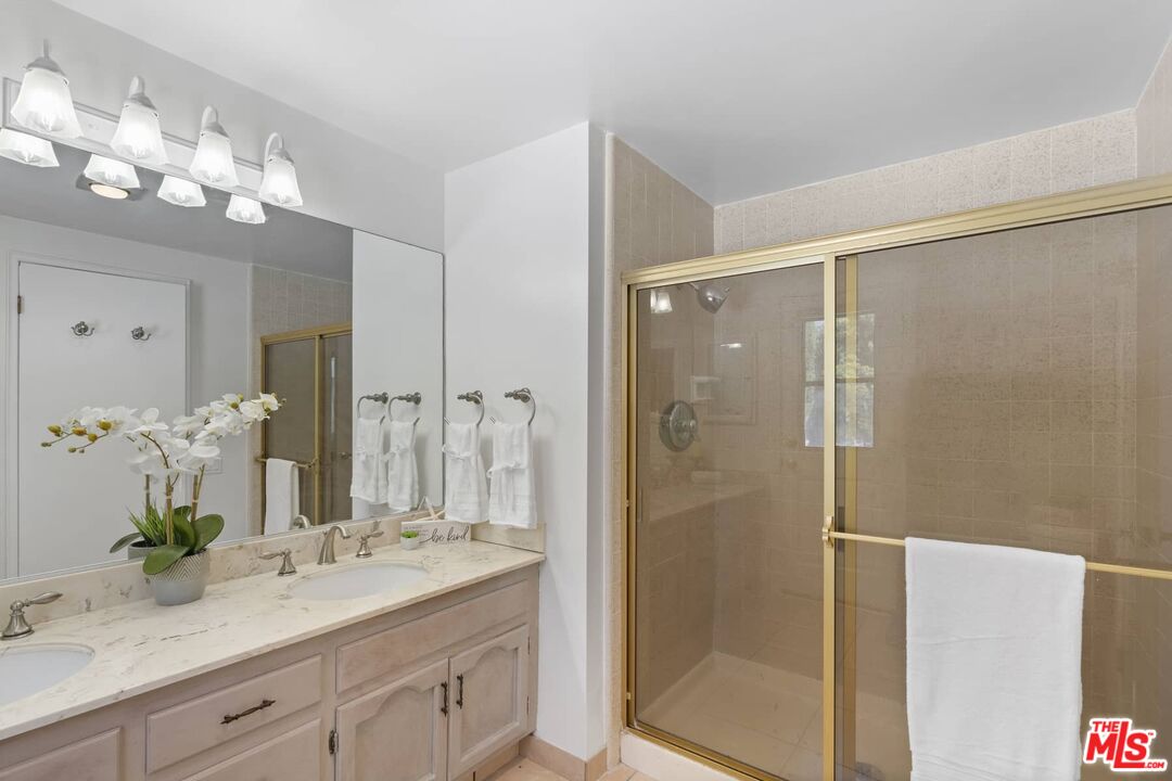 26741 Nokomis Road Rancho Palos Verdes, CA 90275 - Photo 22 of 28 a bathroom with a granite countertop shower sink and mirror