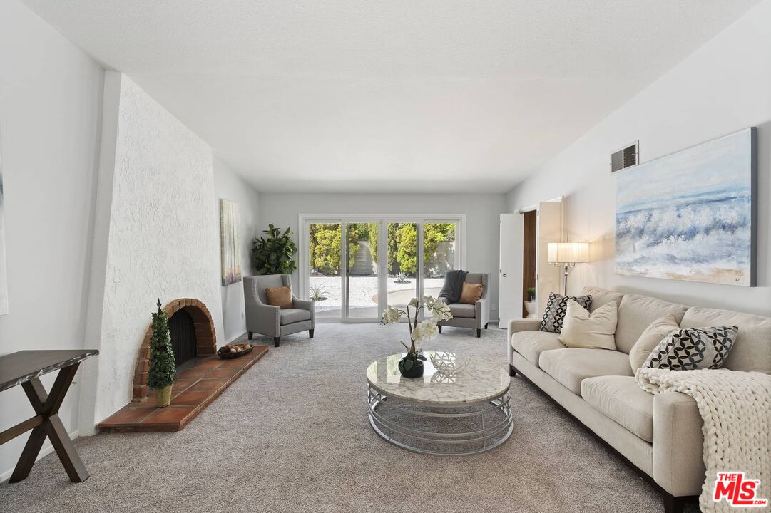 26741 Nokomis Road Rancho Palos Verdes, CA 90275 - Photo 4 of 28 a living room with furniture and a large window