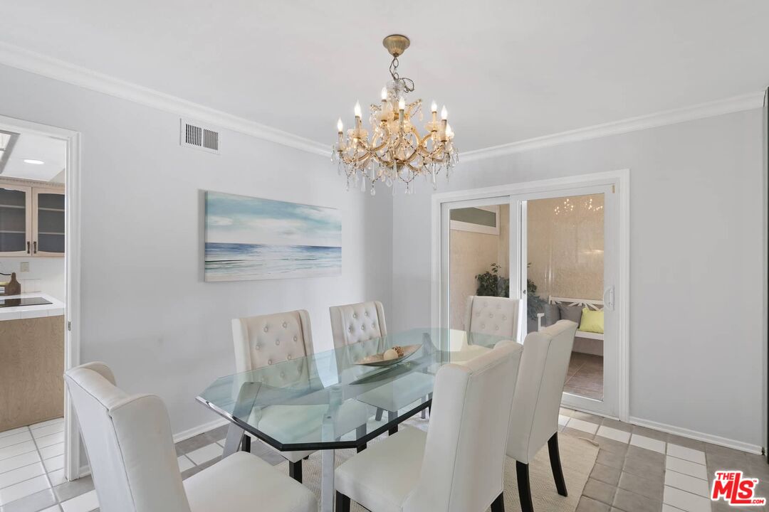 26741 Nokomis Road Rancho Palos Verdes, CA 90275 - Photo 6 of 28 a view of a dining room with furniture and chandelier