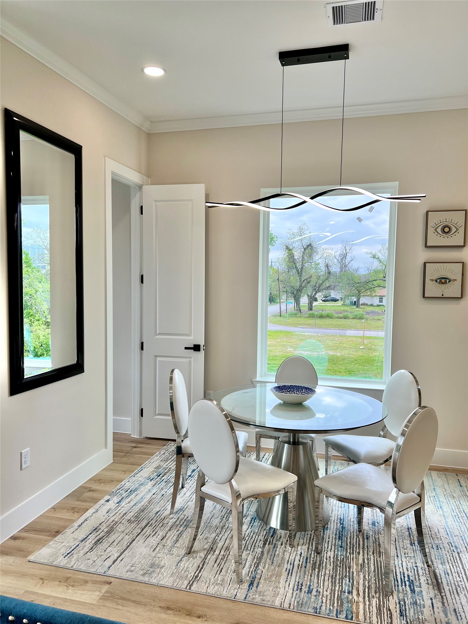 3231 Tuam Street Houston, TX 77004 - Photo 18 of 49 a view of a dining room with furniture and wooden floor