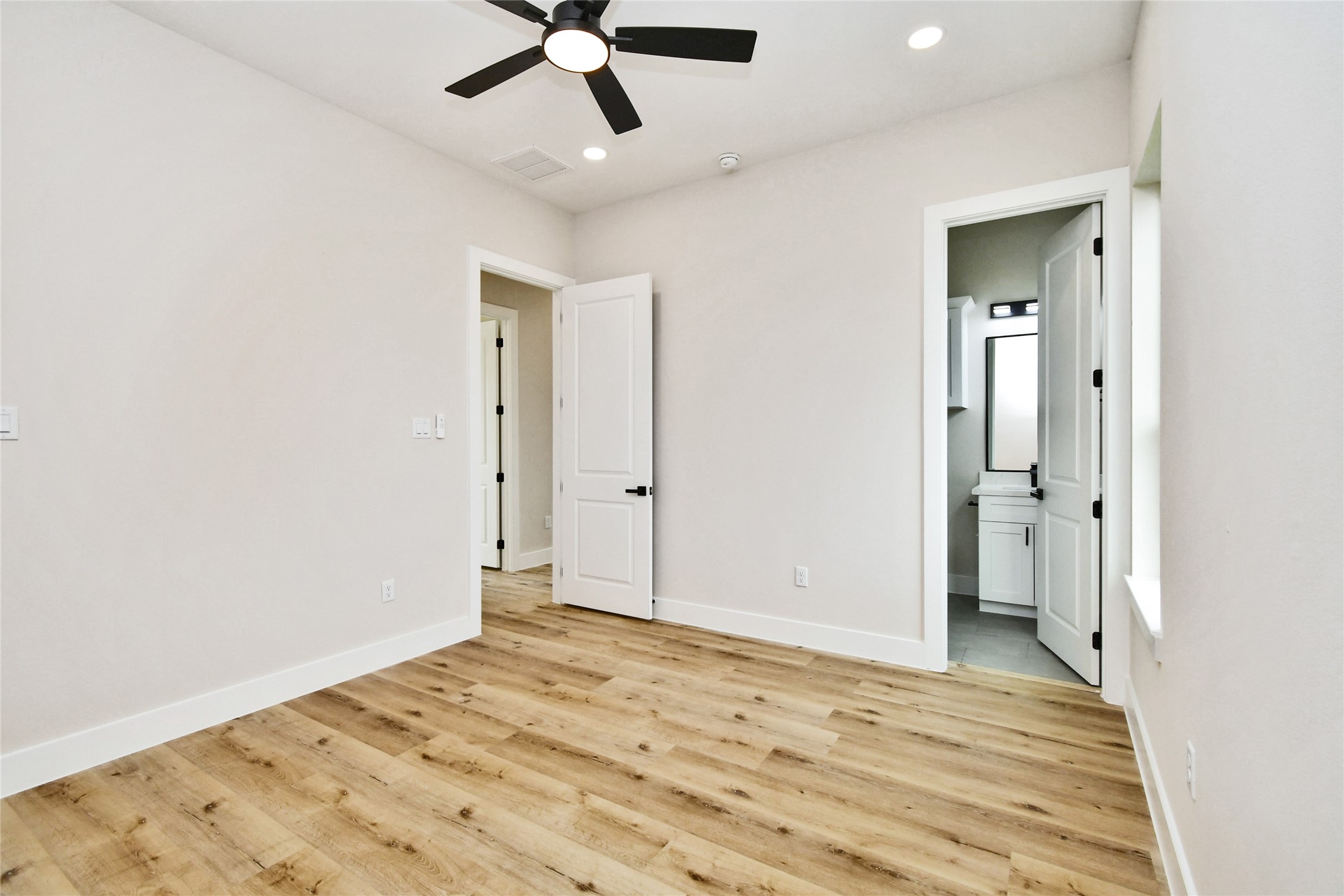 3231 Tuam Street Houston, TX 77004 - Photo 36 of 49 a view of a big room with wooden floor and closet