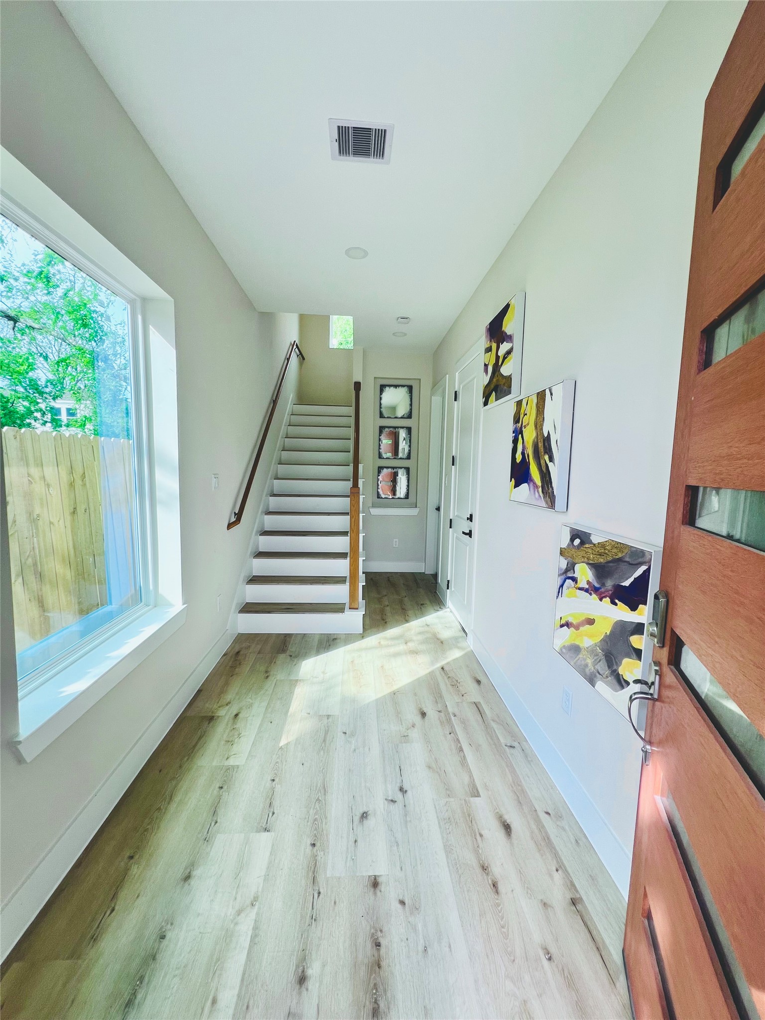 3231 Tuam Street Houston, TX 77004 - Photo 4 of 49 a view of an entryway with wooden floor