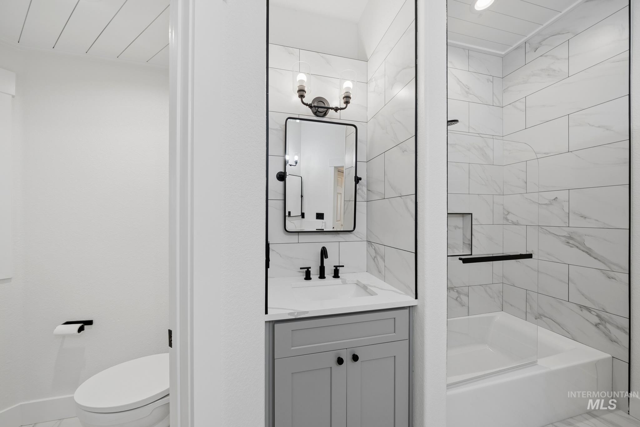 2050 Artesian Road Eagle, ID 83616 - Photo 33 of 49 Dual vanity bathroom featuring quartz-finish countertops and integrated sinks