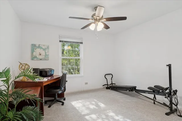 a room with gym equipment and a window
